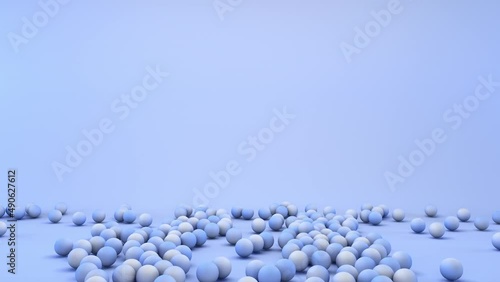Falling colored balls on light blue background with blank copy space to insert text, Full HD animation for presentation