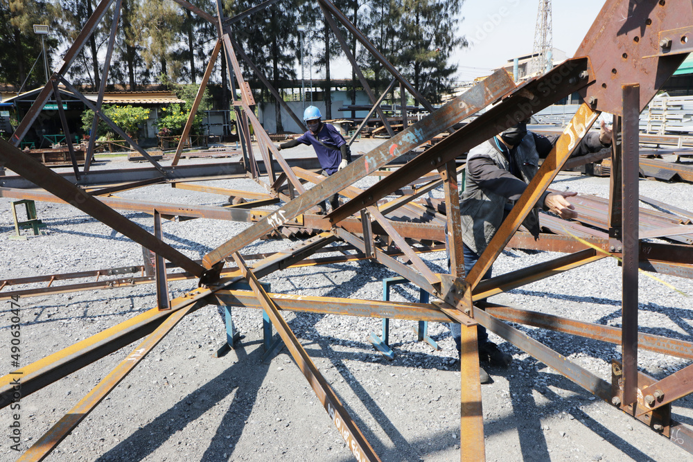 assembly of rust steel prototype for steel tower at steel factory