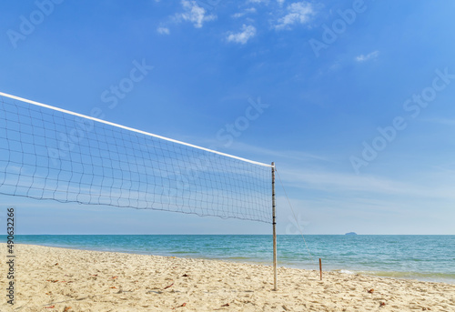 Landscape view tropical beach with volleyball net on empty sandy beach with blue sky in sunny day