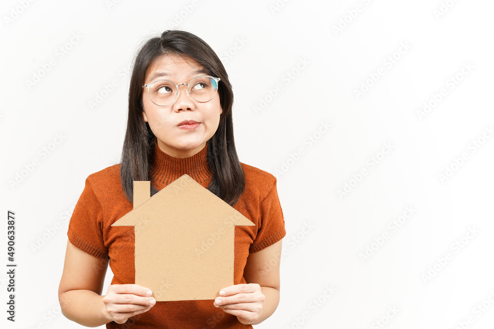 Holding House Cutout Of Beautiful Asian Woman Isolated On White Background Holding House Cutout Of Beautiful Asian Woman Isolated On White Background