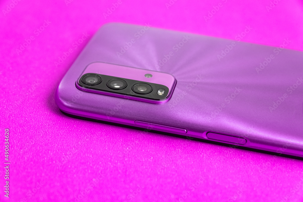 New cell phone over colorful background New cell phone over colorful background