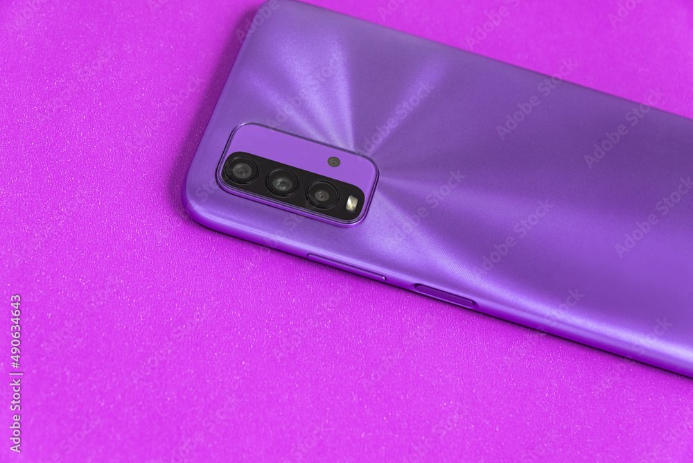 New cell phone over colorful background New cell phone over colorful background
