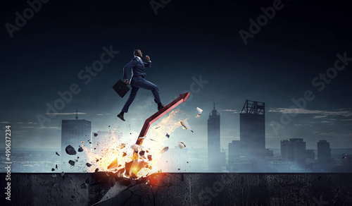Determined businessman on his way to success leaving fire trails © Sergey Nivens