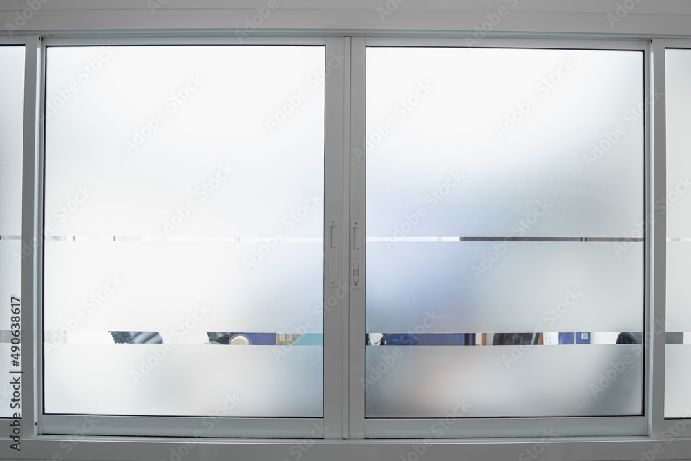 Frosted glass texture on the office glass for reduced visibility across