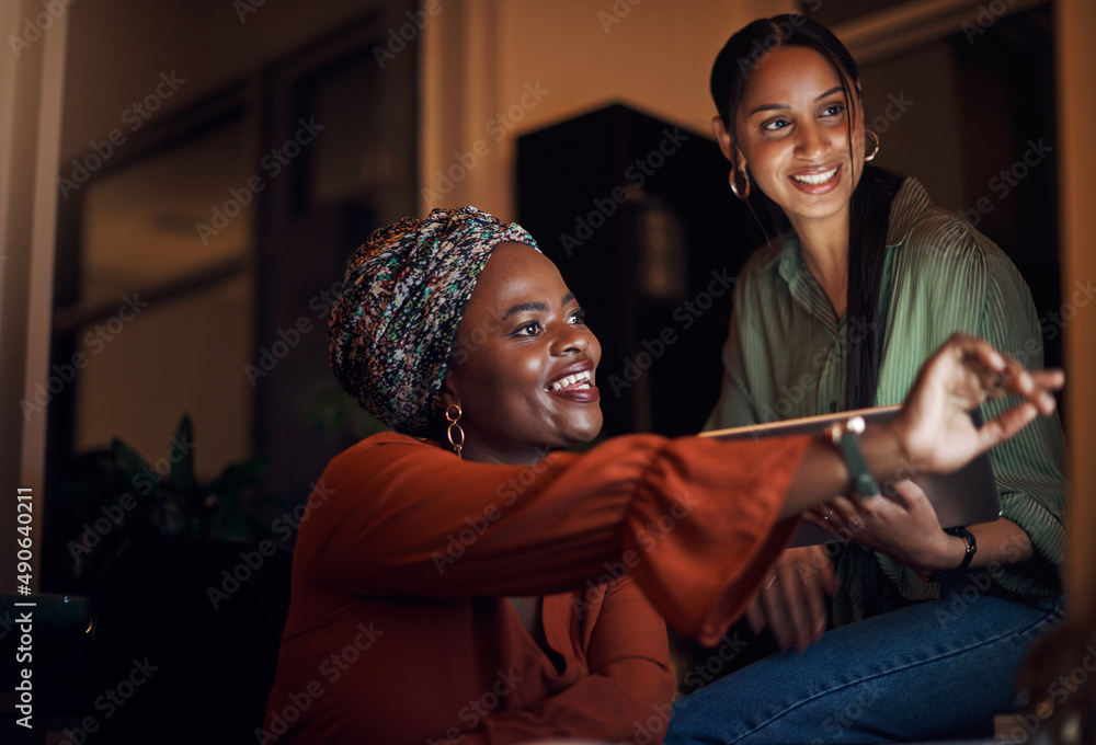 This might be the solution weve been looking for. Shot of two businesswomen working together on a computer in an office at night.