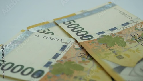 Counting korea money banknotes.