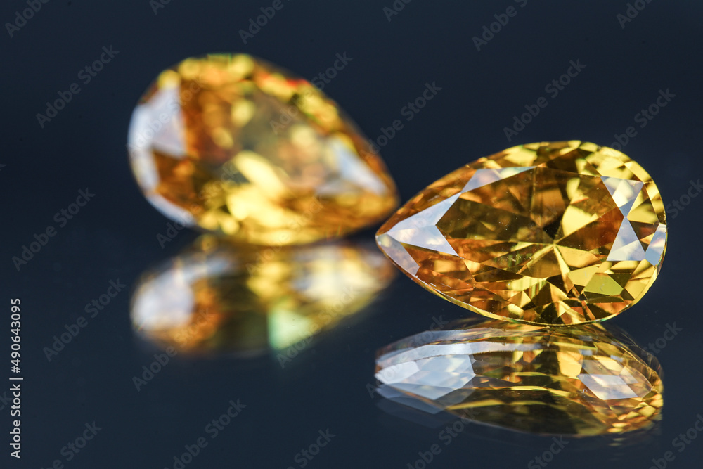 Natural Sapphire gemstone, Jewel or gems on black shine color, natural yellow gemstones on stone Natural Sapphire gemstone, Jewel or gems on black shine color, natural yellow gemstones on stone
