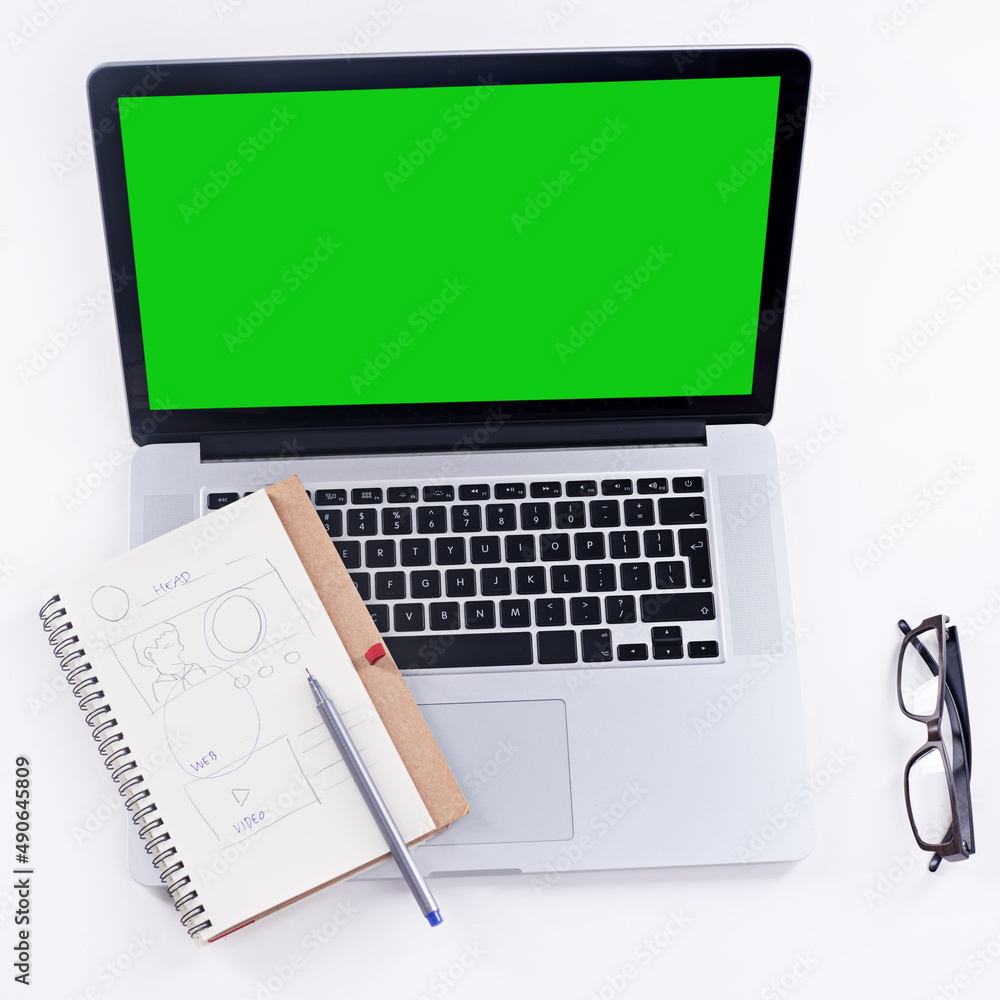 Tools to get the job done. Shot of a laptop with a green screen. Tools to get the job done. Shot of a laptop with a green screen.