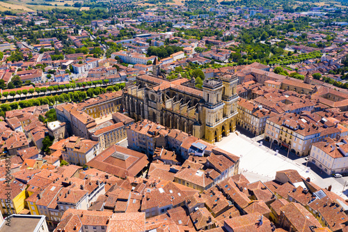 Fototapeta Naklejka Na Ścianę i Meble -  Aerial view of Auch cityscape overlooking medieval Gothic building of Sainte-Marie Cathedral on summer day, France