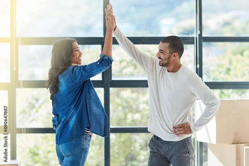 © Nola V/peopleimages.com - Excited about their new beginning. Shot of a happy young couple moving into their new home together.