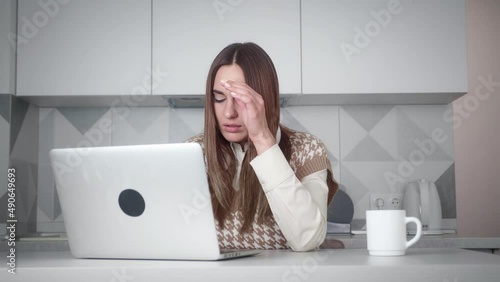 Millennial business woman freelance worker user designer working in home office sitting at table with laptop typing makes mistake low battery computer problems broken network application error panics