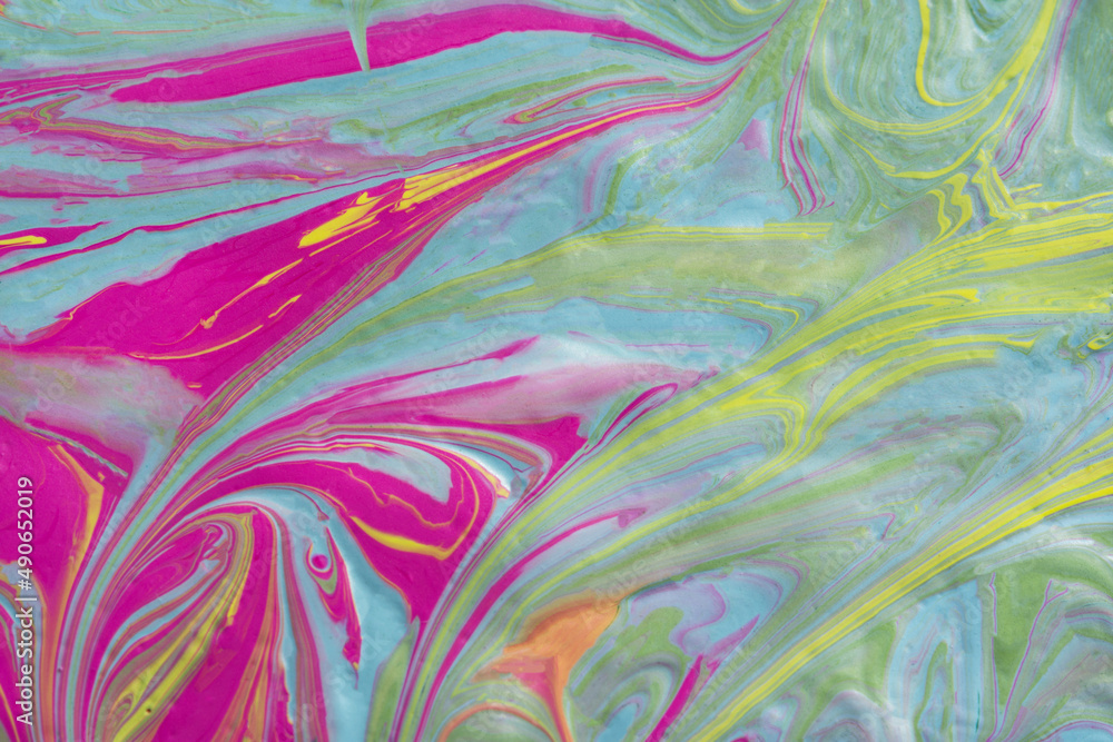 Fototapeta premium Abstract fluid art texture. A multicolored pictorial fragment of a painting. Bright acrylic drawing of pink, yellow, purple, pale green and blue shades close-up. The concept of summer mood, flowering