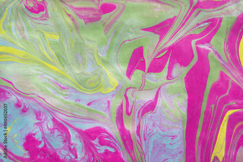 Abstract fluid art texture. A multicolored pictorial fragment of a painting. Bright acrylic drawing of pink, yellow, purple, pale green and blue shades close-up. The concept of summer mood, flowering