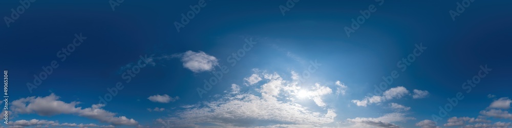 Blue sky panorama with Cirrus clouds in Seamless spherical equirectangular format. Full zenith for use in 3D graphics, game and editing aerial drone 360 degree panoramas for sky replacement.