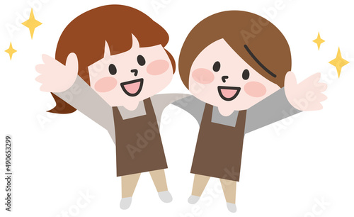 肩を組むエプロンをつけた人たち 