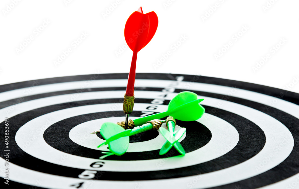 Red dart arrow hitting in the center of the dartboard Red dart arrow hitting in the center of the dartboard