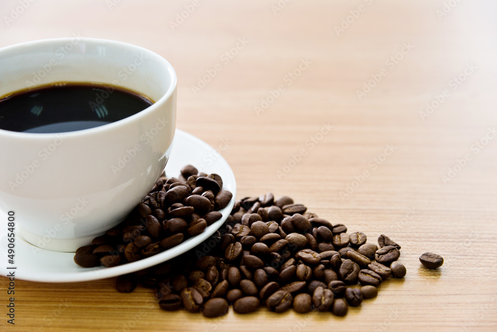 Fototapeta premium Coffee and beans on wooden table