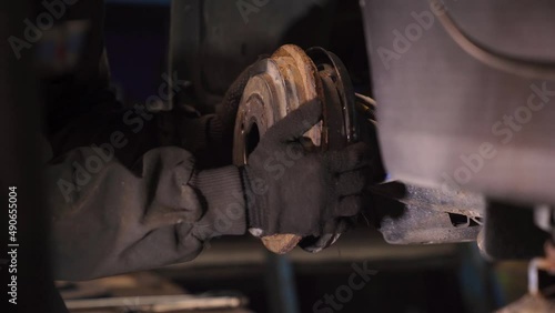 Garage Worker Changes Rear Brake Pads in Car, Removes Brake Discs photo