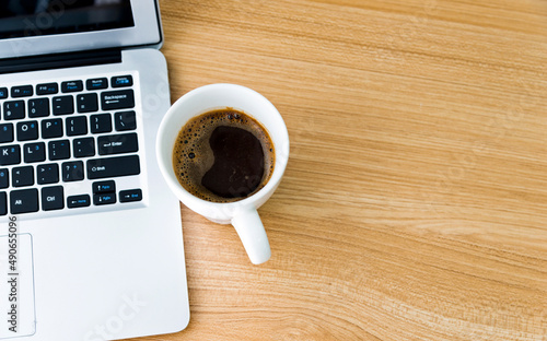 Desk with laptop and a cup of coffee