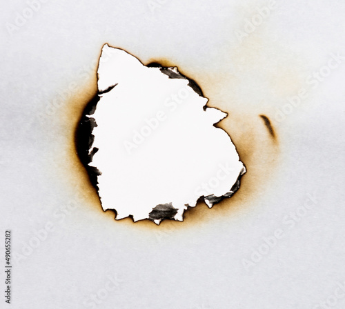Burned hole on a white paper
