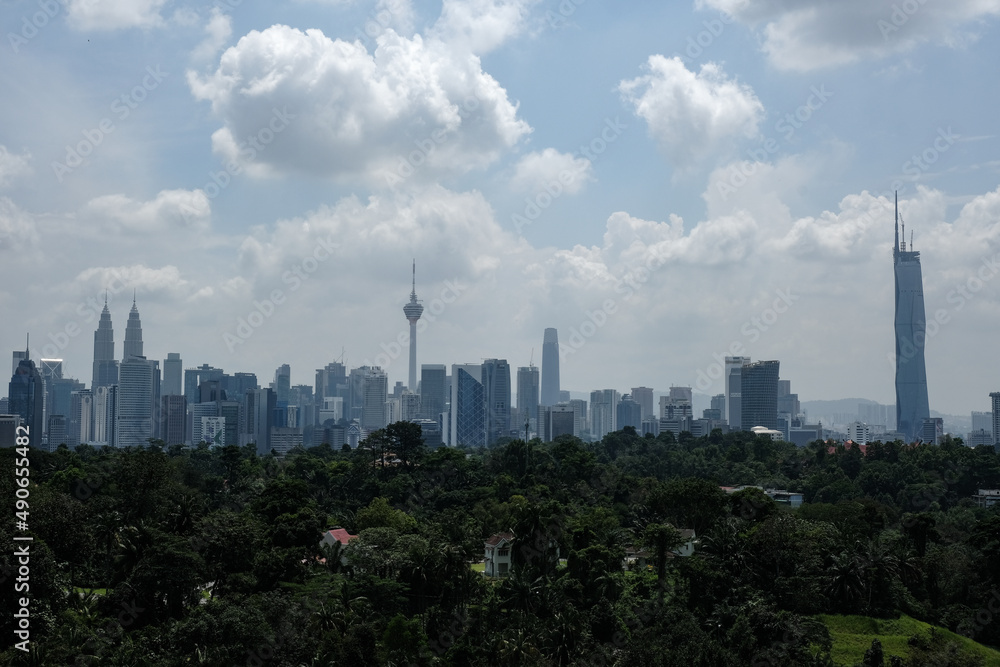 Fototapeta premium A noise effect picture of hazy and foggy cloudy Kuala Lumpur City with iconic tower insight.