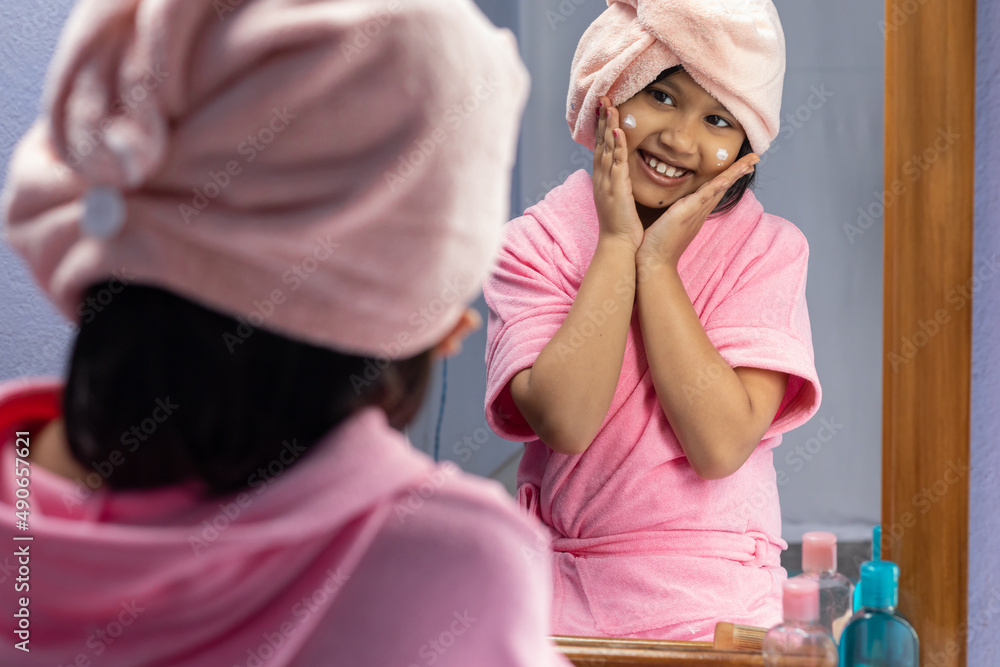 Girl child in pink bathrobe