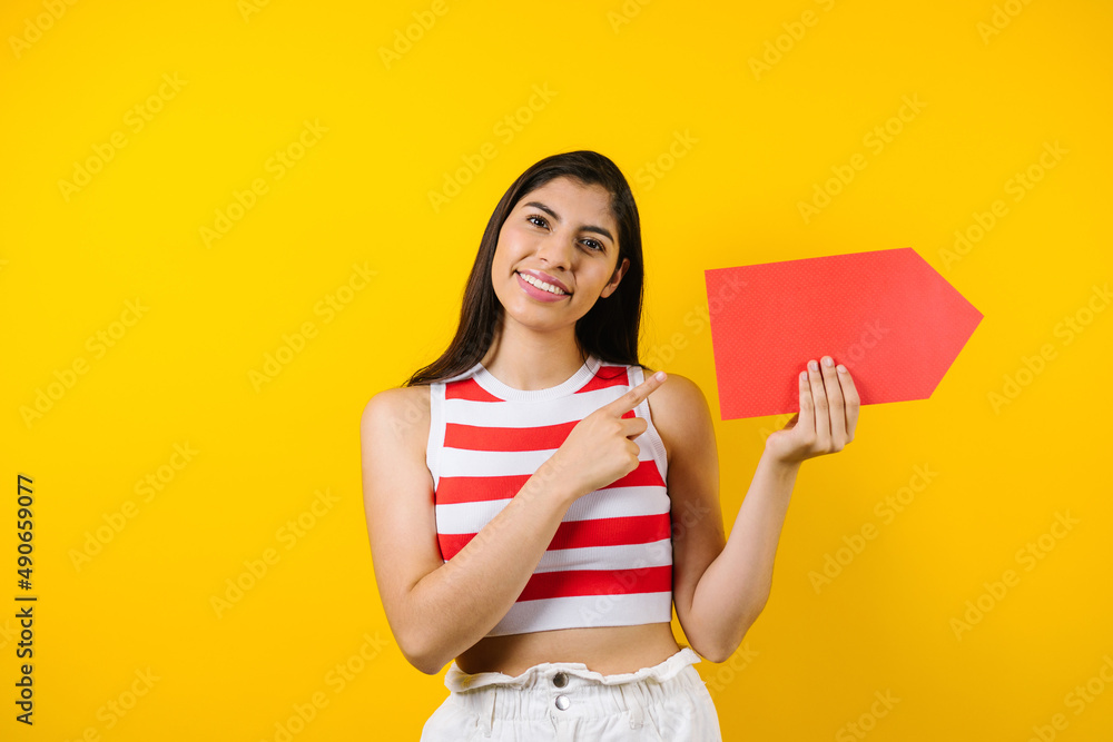 portrait of brunette young latin woman with copy space on yellow background in Latin America portrait of brunette young latin woman with copy space on yellow background in Latin America