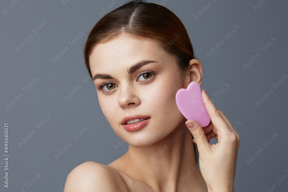 beautiful woman scraper gua sha facial care home facial massage isolated background beautiful woman scraper gua sha facial care home facial massage isolated background