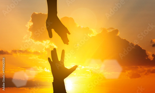 hand shadow of helping hand concept and international day of peace thanks for your support. how can i help you international day of peace develop friendship please help me