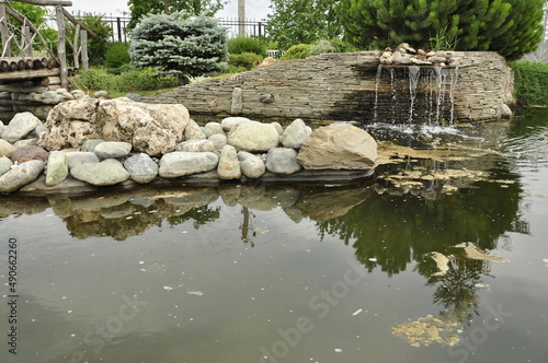 Garden pond. Pond in landscape design.