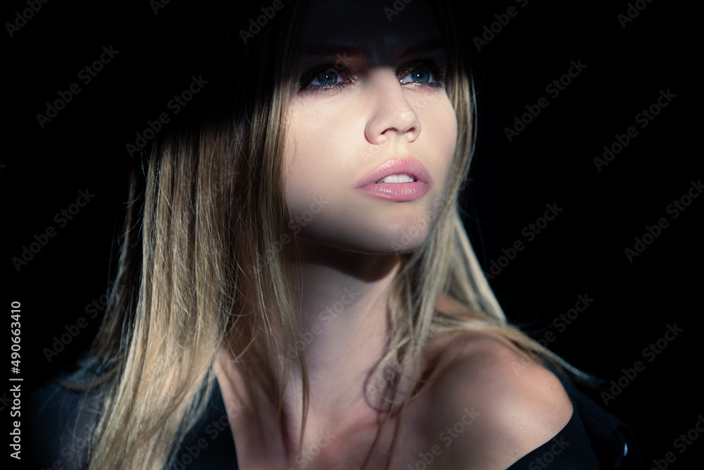 Beautiful young woman portrait closeup on black. Sensual face of elegant female model in studio. Elegant lady. Beautiful young woman portrait closeup on black. Sensual face of elegant female model in studio. Elegant lady.