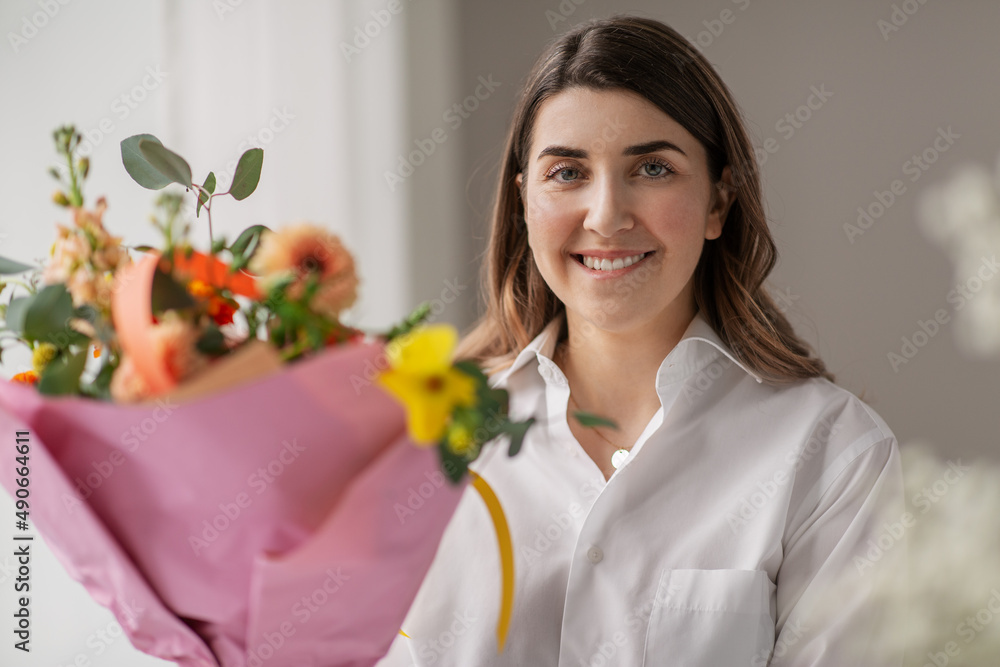 people, gardening and floral design concept - portrait of happy smiling woman or floral artist with bunch of flowers at home people, gardening and floral design concept - portrait of happy smiling woman or floral artist with bunch of flowers at home