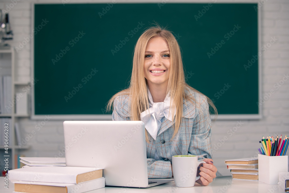 Student preparing exam and learning lessons in school classroom. Webinar e-learning at school, distance education. Student preparing exam and learning lessons in school classroom. Webinar e-learning at school, distance education.