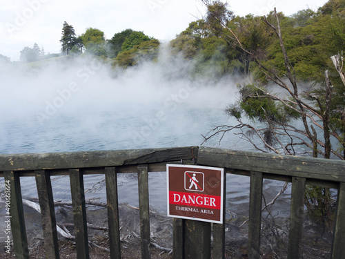Thermal area danger sign at a geothermal park in Rotorua, New Zealand