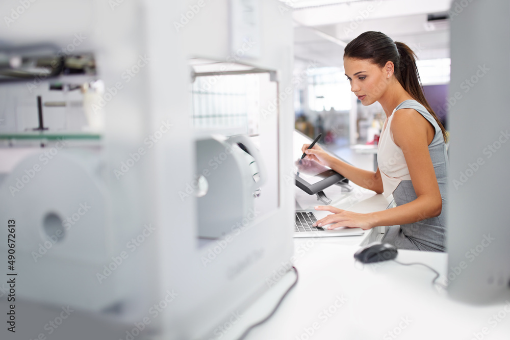 Printing has just gone 3D. Cropped shot of an attractive young woman working beside a 3D printer.