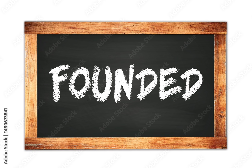 FOUNDED text written on wooden frame school blackboard. FOUNDED text written on wooden frame school blackboard.