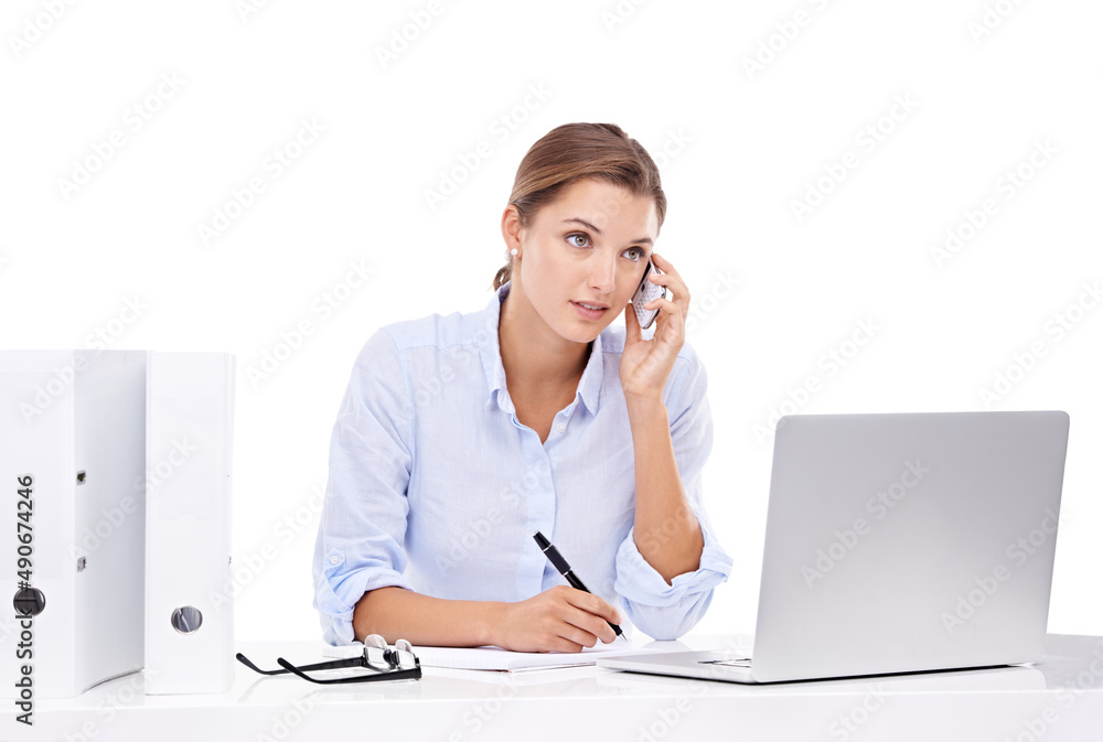 Shes hard at work - Multi-tasking. An attractive young businesswoman talking on the phone and working on her laptop. Shes hard at work - Multi-tasking. An attractive young businesswoman talking on the phone and working on her laptop.
