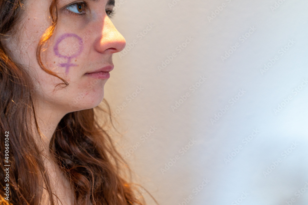 young girl with feminist symbol young girl with feminist symbol