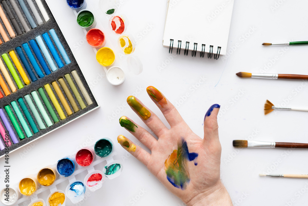 Naklejka premium Flat composition set of artistic tools. Brushes, paints, pencils, pastels for drawing. Place for text.