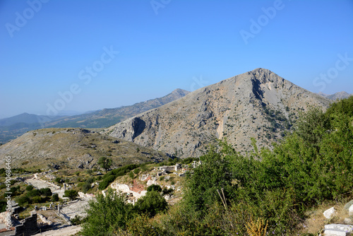 mountain ridge with green trees on blue sky background, Turkey