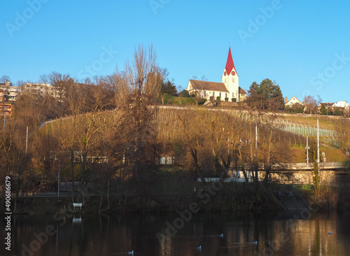 Zurich, Switzerland - December 18th 2022: The church of Hoengg, located on a hill above the Limmat river photo