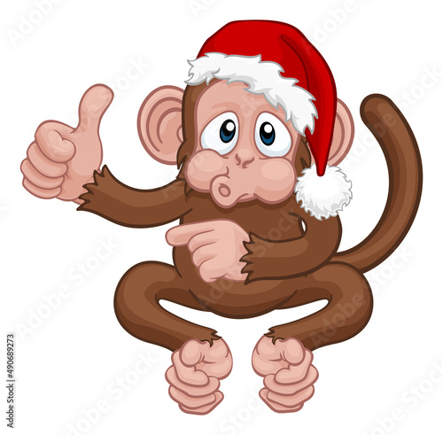 Christmas Monkey Cartoon Character in Santa Hat photo