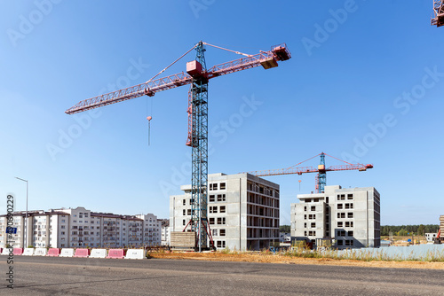 Construction site, work of cranes in construction