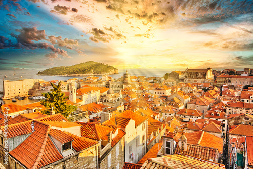 Aerial view at sunset on Dubrovnik walls in Croatia. View of Cathedral of the Assumption of the Virgin Mary and church Crkva sv. Vlaho Saint Biagio of Dubrovnik UNESCO town of Croatia in Dalmatia