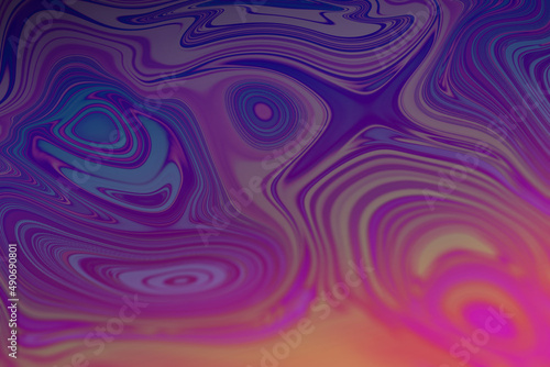 Abstract textured iridescent multicolored liquid background in blue tones.