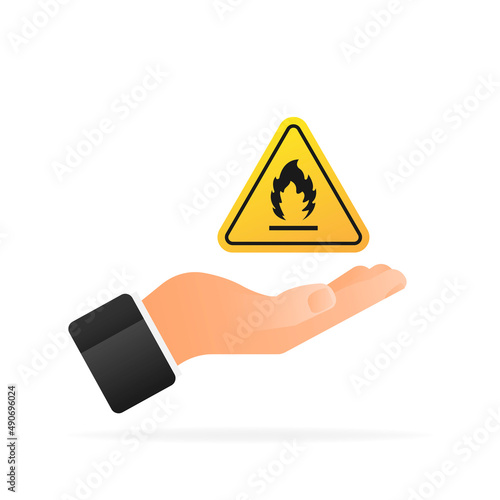 Fire flame danger icon in hand. Yellow illustration on white backdrop. Vector illustration photo