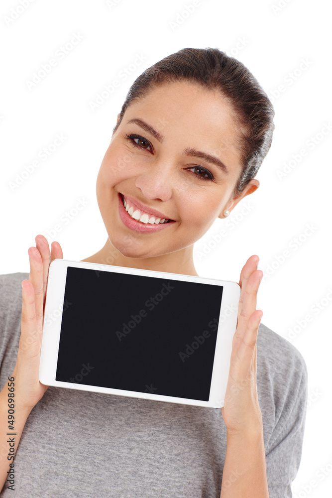 Her most prized possession. Studio shot of an attractive young woman holding up a digital tablet.