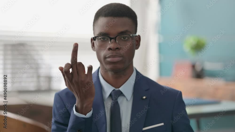 Young African Businessman Showing Middle Finger Young African Businessman Showing Middle Finger