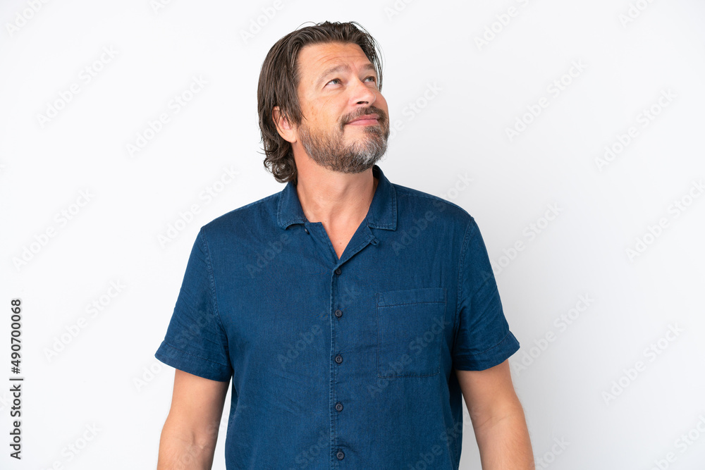 Fototapeta premium Senior dutch man isolated on white background thinking an idea while looking up