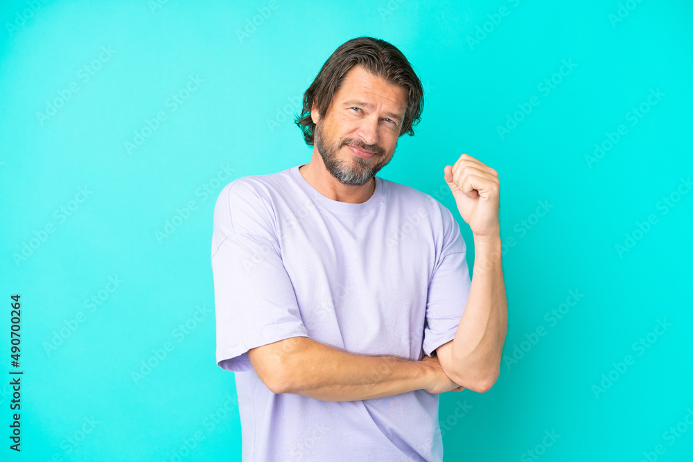 Senior dutch man isolated on blue background laughing Senior dutch man isolated on blue background laughing
